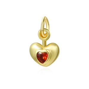 Detailed view of an 18k gold-plated heart pendant with a vibrant red zircon stone