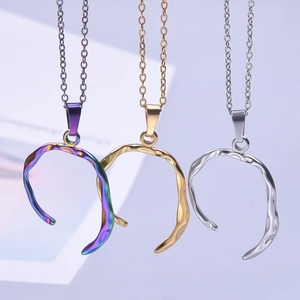 Minimalist liquid metal horseshoe necklace in gold, silver, and iridescent finishes