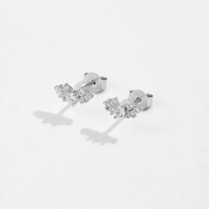 Detailed macro view of S925 sterling silver stud earrings with sparkling zircon clusters