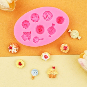Rosa Silikonform für DIY-Fondant mit Cupcake- und Lutscherformen auf gelbem Grund