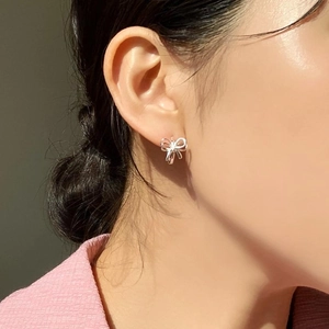 925 sterling silver butterfly stud earrings in a minimalist three-dimensional ribbon design
