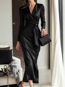Close-up of elegant black satin dress fabric texture with waist tie and V-neck detail