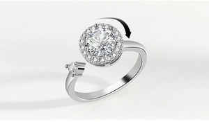 Detailed view of rotating silver fidget ring with sparkling halo moissanite sunflower detail