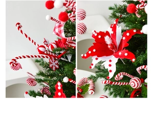 Close-up of red and white Christmas tree picks with polka dots and spiral stripes