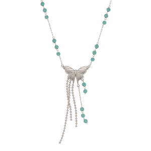 Silver butterfly fringe necklace with light green beads in a minimalist still life style