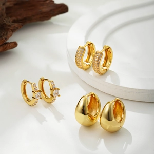 Three-piece set of 18K gold-plated hoop earrings with pave cubic zirconia and polished finish