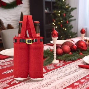 Detail of red Santa pants wine bottle bag with double slots on a festive dining table