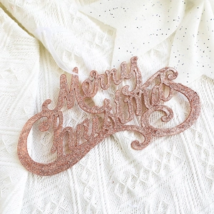 Sparkly rose gold Merry Christmas lettering wooden tag with white ribbon hanger