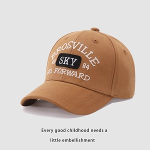Close-up of embroidery details and SKY letters on brown cotton kids baseball cap
