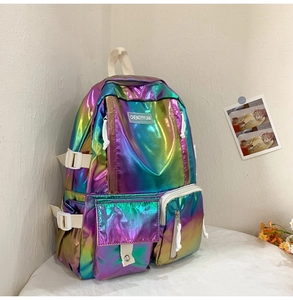 Detailed macro view of laser holographic backpack with iridescent finish and zip pocket