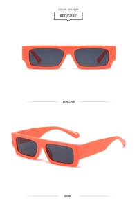 Detail view of bright orange rectangular retro sunglasses showing front and side profiles