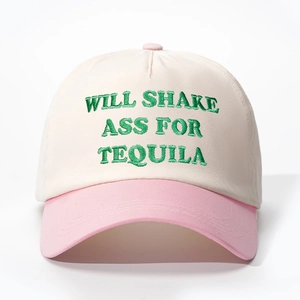 Detail of WILL SHAKE ASS FOR TEQUILA embroidery on a pink and beige baseball cap