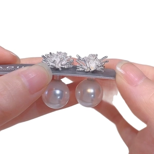 Elegant floral silver needle earrings with large white pearls and sparkling zircon accents