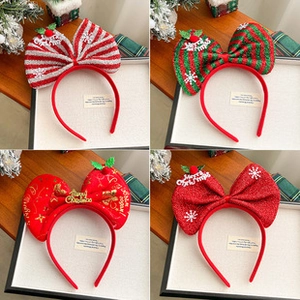Detail showing four Christmas themed headbands with festive bows and sequins