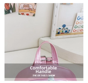 Detail of pink metallic leather backpack showing sturdy top handle and stitching