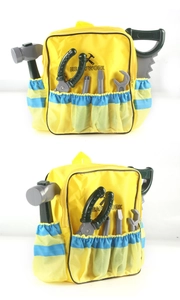 Detail of yellow canvas tool backpack with mesh pockets and gray toy tools for kids
