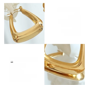 Detailed view of 18K gold-plated titanium steel U-shaped earrings with a polished finish