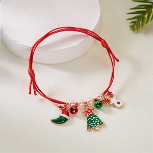 Detail of red woven Christmas bracelet featuring enamel tree, deer, and pearl charms