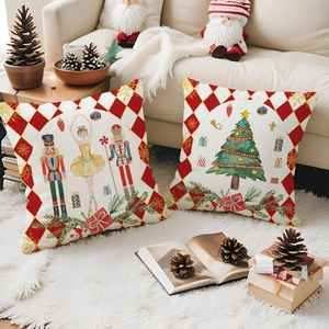 Detail of Christmas Nutcracker and tree cushion covers on soft white rug with festive decor
