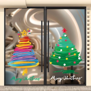 Detail of colorful hand-drawn Christmas tree window stickers with Merry Christmas text