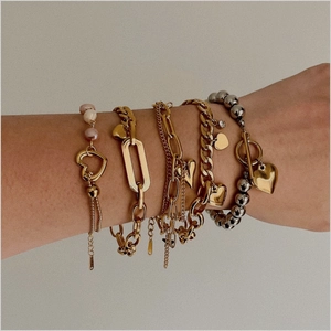 Stack of gold OT buckle heart pearl bracelets with stainless steel Cuban chain styles