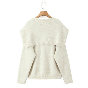 Detail of cream long-sleeved knit top with large shawl collar and ribbed textures