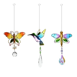 Detail of colorful metal butterfly, hummingbird, and dragonfly wind chime with crystal prisms