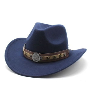Detail of navy wool cowboy hat with leather band and engraved floral metal buckle