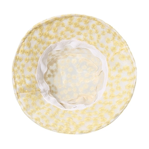 Detail view of the daisy lace bucket hat showing yellow embroidery and inner sweatband