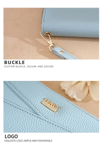 Detail of light blue textured wallet featuring gold metal hardware and brand logo plate