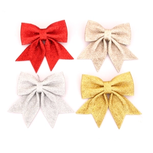 Glittery Christmas bows in red gold silver and champagne for tree decoration