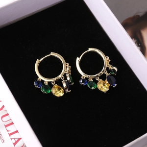 Elegant gold drop earrings featuring multi-colored gemstones on black velvet background