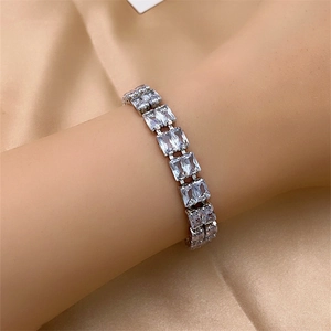 Close-up of sparkling rectangle-cut cubic zirconia bracelet on a silver metal setting
