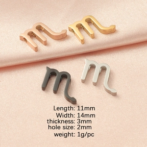 Detail view of 11x14mm stainless steel letter charms in gold, silver, rose gold and black