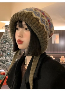 Detail of retro Fair Isle knit hat with colorful patterns and ear flaps for winter warmth