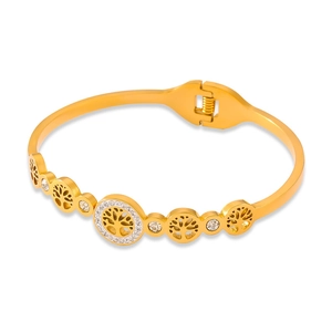 Polished gold Tree of Life bangle with sparkling crystal center on white background