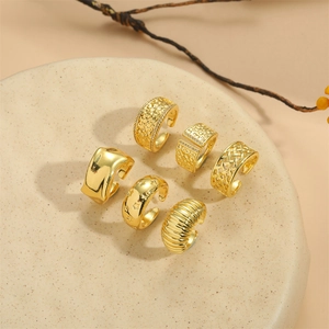 6-piece set of adjustable gold rings featuring croissant, star, and textured metal designs