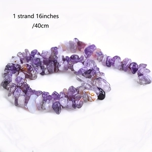 Detail of a 16-inch strand of polished natural amethyst crystal chips for jewelry making