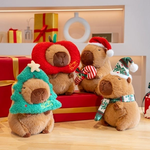 Christmas Capybara plush collection with festive hats and scarves on a cozy wooden table