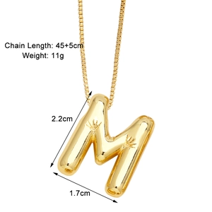 Detail of 3D gold initial M pendant with sunburst texture and 45+5cm box chain