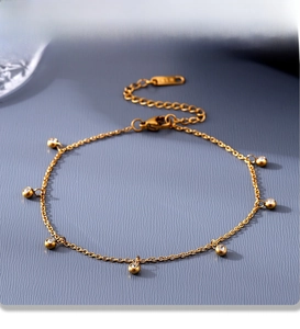Macro detail of PVD plated stainless steel anklet with cubic zirconia and K18 hallmark tag