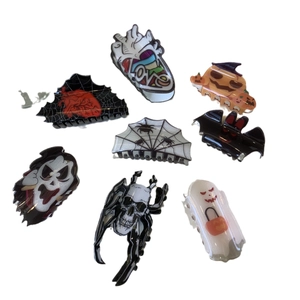 Halloween hair claw clips set with ghost pumpkin spider and bat designs on white background
