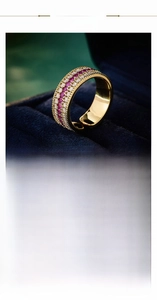 Detail view of gold and silver adjustable rings with triple-row pavé crystals