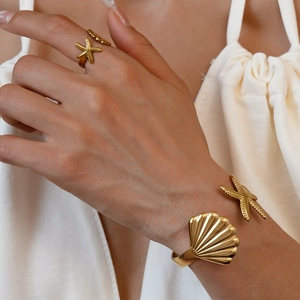 Golden sea shell and starfish stainless steel open jewelry set with textured finish