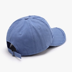 Distressed blue cotton baseball cap with vintage worn-out details and metal buckle back