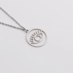 Detailed close-up of a minimalist hollow evil eye pendant on a fine stainless steel chain