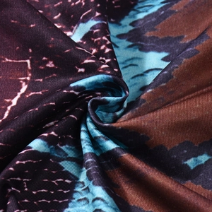 Detailed macro view of the soft snake print fabric texture with blue and purple tones