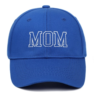 Close-up of navy blue cotton baseball cap featuring bold white MOM embroidery detail