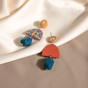 Vintage geometric long drop earrings in yellow and blue acrylic for a retro look