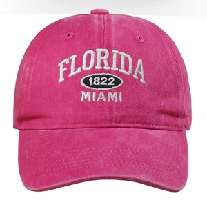 Detailed embroidery of Florida Miami 1822 text on a pink washed cotton baseball cap